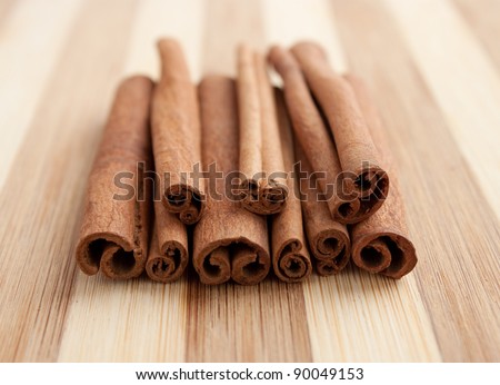 whole cinnamon sticks on a wooden board