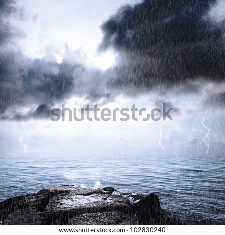 Rain and thunderstorm in the ocean with sunlight