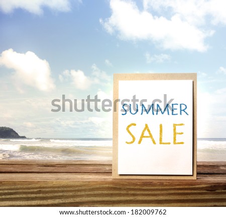 Summer sale sign over blue ocean and sky