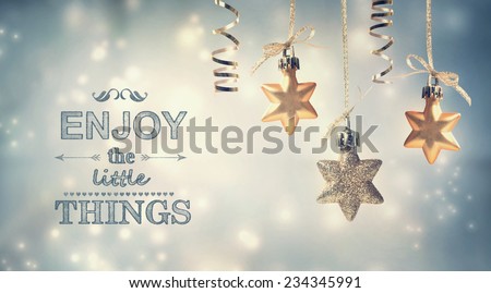 Enjoy the Little Things text with hanging star ornaments in the night