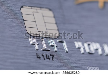 Low angle view of the microchip and raised numbers on a bank card