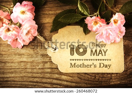 May 10th Mothers Day card with small roses on wood background
