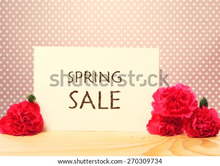 Spring Sale card with pink carnations over polka dots background