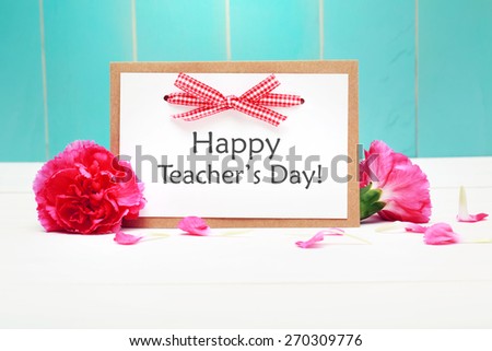 Happy Teachers Day card with pink carnations over teal wooden wall