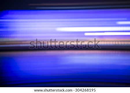 Abstract blue horizontal streaked city lights background