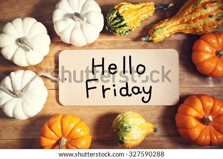 Hello Friday message with colorful pumpkins and squashes