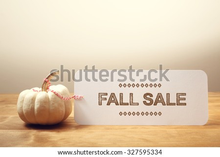 Fall Sale message with a white small pumpkin