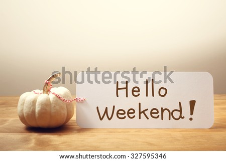 Hello Weekend message with a white small pumpkin