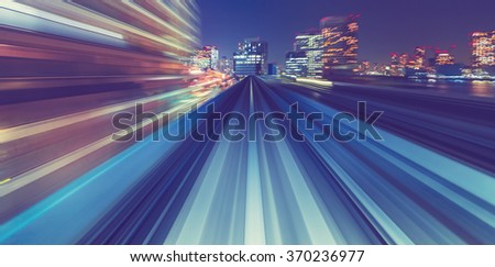 Abstract high speed technology POV motion blurred concept image from the Yuikamome monorail in Tokyo Japan