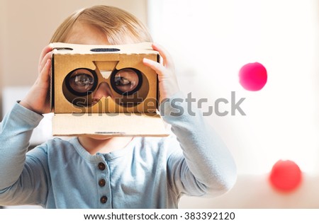 Toddler girl using a new virtual reality headset