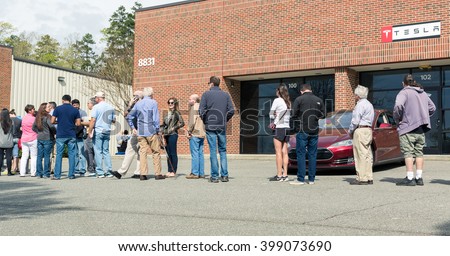 RALEIGH, NC USA. MARCH 31 2016: Customers queue at a Tesla Motors location in order to reserve a new Tesla Model III.