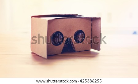Virtual reality cardboard headset on a table in natural light