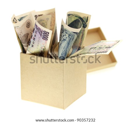 Japanese yen bank notes in the box on white background