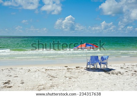 Two Beach Chairs with Umbrella on the Beach