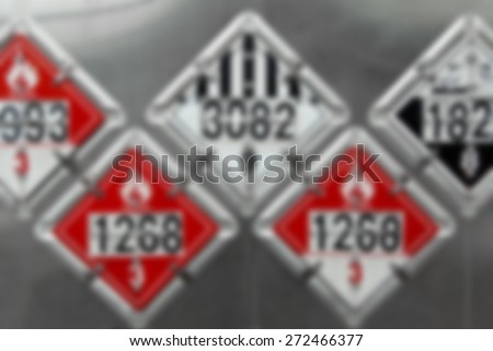 Blur Background Image - USDOT Hazardous Materials Transportation Placards on rear of a Fuel Tanker