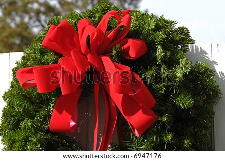 Christmas Wreath on a White Fence