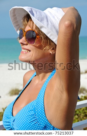 stock photo Attractive Mature Woman in Swimsuit Enjoying the Beach