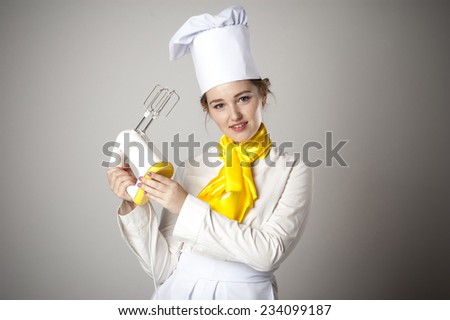 Photo of a smiling cook with mixer