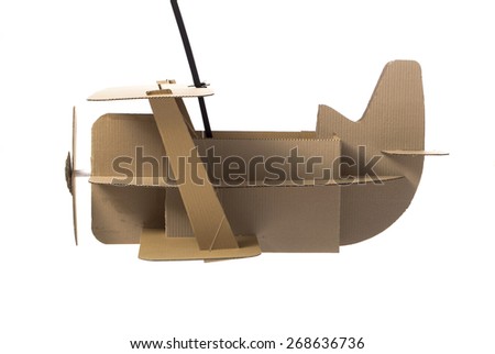 Photo of  cardboard plane on white background. Biplane. Side view.