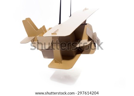 Photo of  cardboard plane on white background. Biplane.