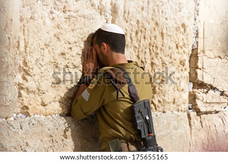 Golani Soldier praying at the Wailing Wall with weapon, Jerusalem, Israel