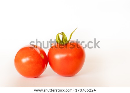 ISRAEL, TOMATO FARM, Two red tomatoes side view isolated on white background with shadows
