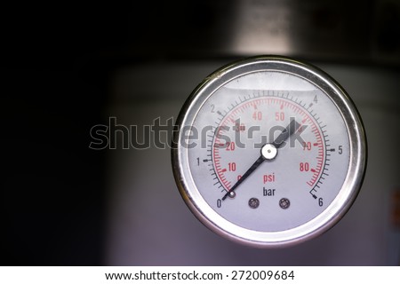 manometer turbo pressure meter gauge in pipes oil plant with liquid inside