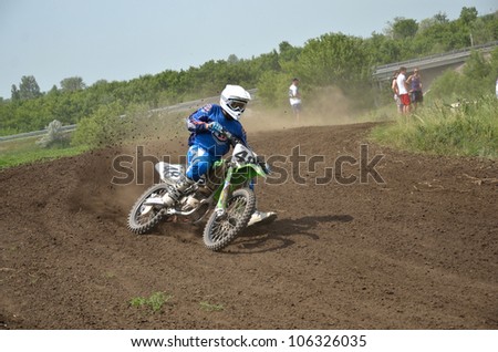 RUSSIA, SAMARA - JUNE 16: Departure with the acceleration out of motocross racer P. Baran, on a sandy road, the Cup of Russia in motocross, the class of \