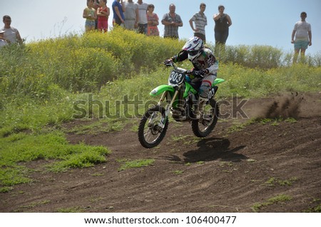 RUSSIA, SAMARA - JUNE 16: Jump on the downhill road motocross racer Sisyukin A. the Cup of Russia in motocross, the class of \