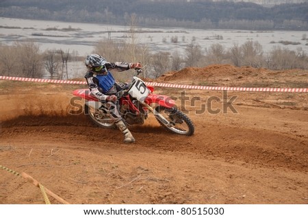 RUSSIA, SAMARA - APRIL 30: Right turn on a motorcycle with a skid and slip the rear wheel accelerates the racer of A.Stepanov the Regional Motocross Championship on April 30, 2011 in Samara, Russia