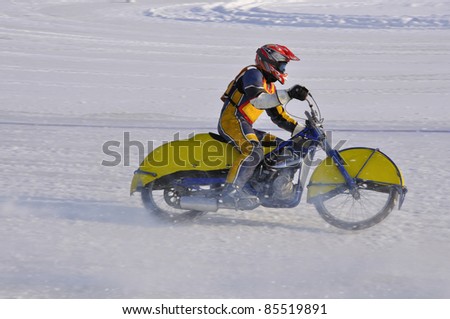 SAMARA, RUSSIA - FEBRUARY 19:  Motorbike with spikes accelerates unidentified rider after the turn of, Speedway on the ice Championship on February 19, 2011 in Samara, Russia