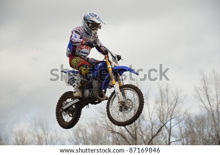 RUSSIA, SAMARA, CHAPAYEVSK - OCTOBER 17: In the air rider unknown on the background the Open Cup 