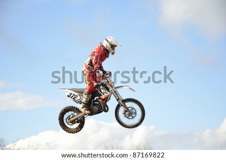 RUSSIA, SAMARA, CHAPAYEVSK - OCTOBER 17: Extreme jump moto racer I. Baranov on the background of clouds the Open Cup 