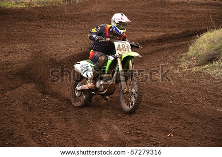 RUSSIA, SAMARA, CHAPAYEVSK - OCTOBER 17: Motorcycle racer S. Astaikin turns with proslipping the Open Cup \