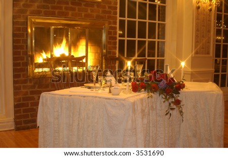 Candlelit Table for Two by fireplace