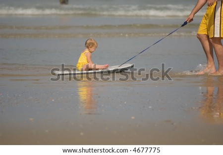 Baby Girl Riding on Boogie Board