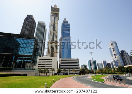 Skyscrapers of Dubai World Trade center rising into the sky.