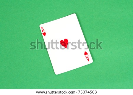 Ace of Hearts on Green Felt Background