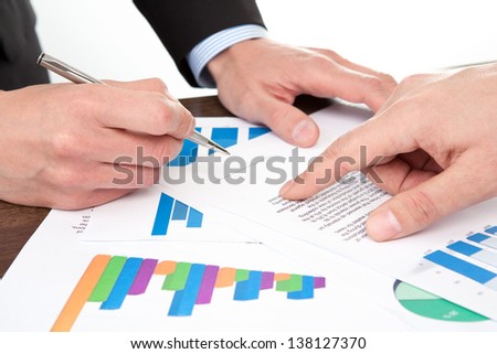 businessmen in the office signing documents
