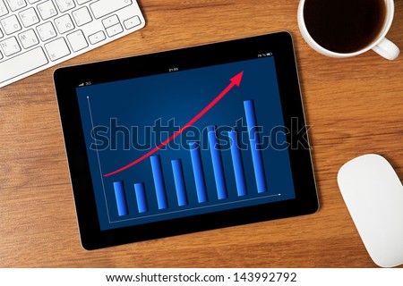 computer tablet with the schedule on the screen on the table of a businessman