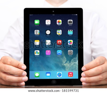 Kiev, Ukraine- March 10, 2014: Apple iPad displaying iOS 7.1 homescreen. iOS 7.1 operating system designed by Apple Inc. official output 10 March 2014. iPad is a tablet produced by Apple Inc.