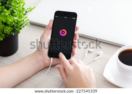 Alushta, Russia - October 24, 2014: Girl holding a iPhone 6 Space Gray with service Beats Music on the screen. iPhone 6 was created and developed by the Apple inc.