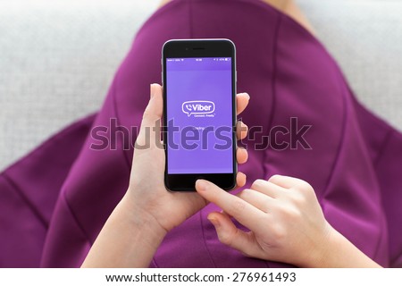 Alushta, Russia - November 22, 2014: Woman holding a iPhone 6 Space Gray with client messaging and voice service Viber on the screen. iPhone 6 was created and developed by the Apple inc.