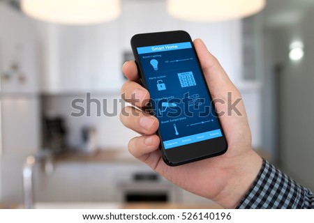 man hand holding phone with smart home on background home room kitchen