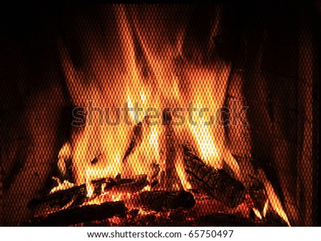 Bright fire burns in a fireplace for new year