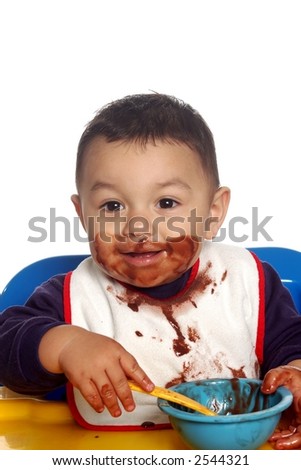 baby eating pudding