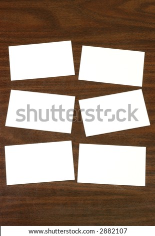Six blank white index cards on a desktop