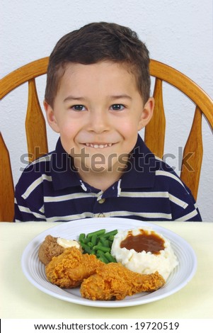 Boy and fried chicken dinner
