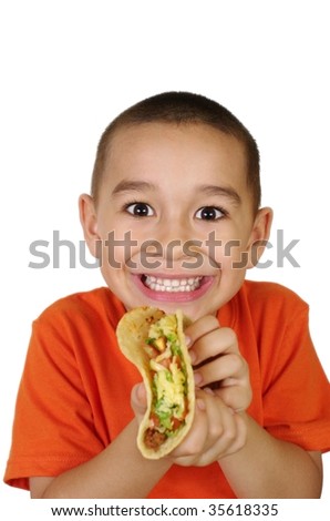 stock photo Hispanic boy holding a Mexicanstyle taco focus is on model's