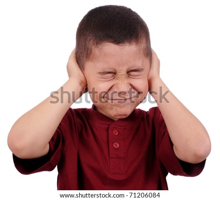 boy covering ears from loud noise, eight years old, isolated on pure white background